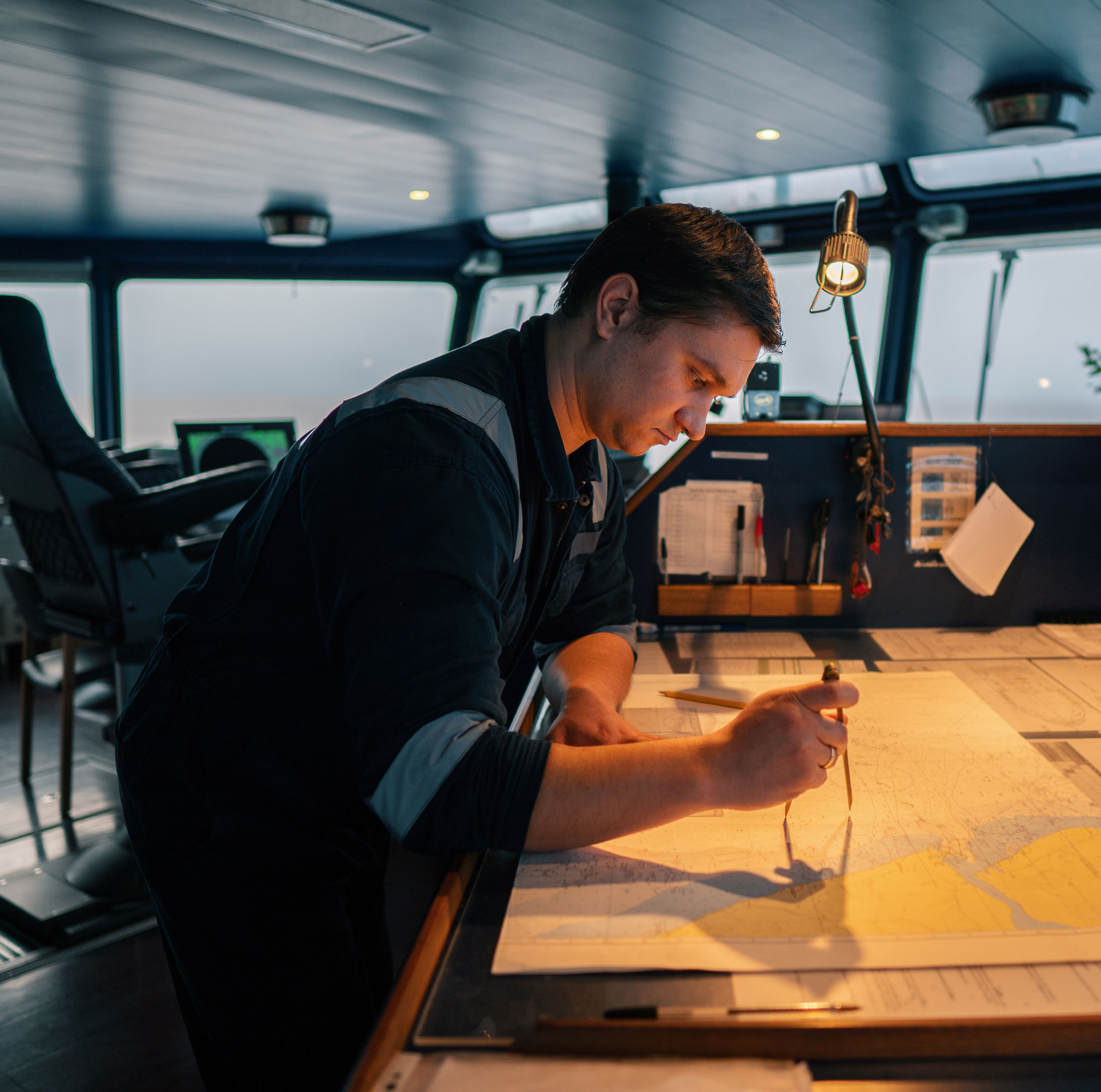 marine-navigator-plotting-a-course-on-vessel-bridg-2026-09-21-20-17-01-utc-copy-2